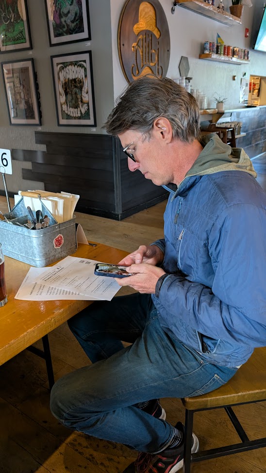 Attendee calling their member of Congress with the script in hand