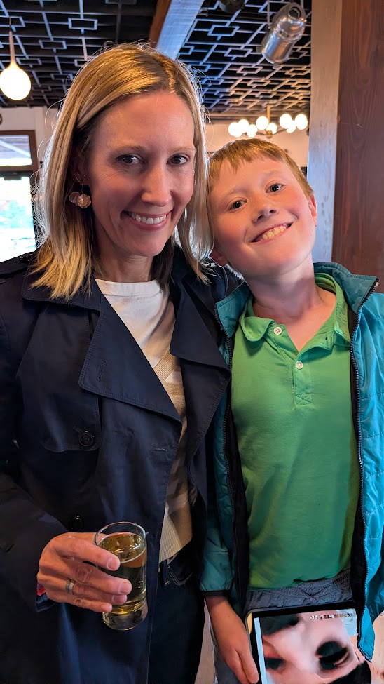 Mother and son smiling at a Democracy on Draft event